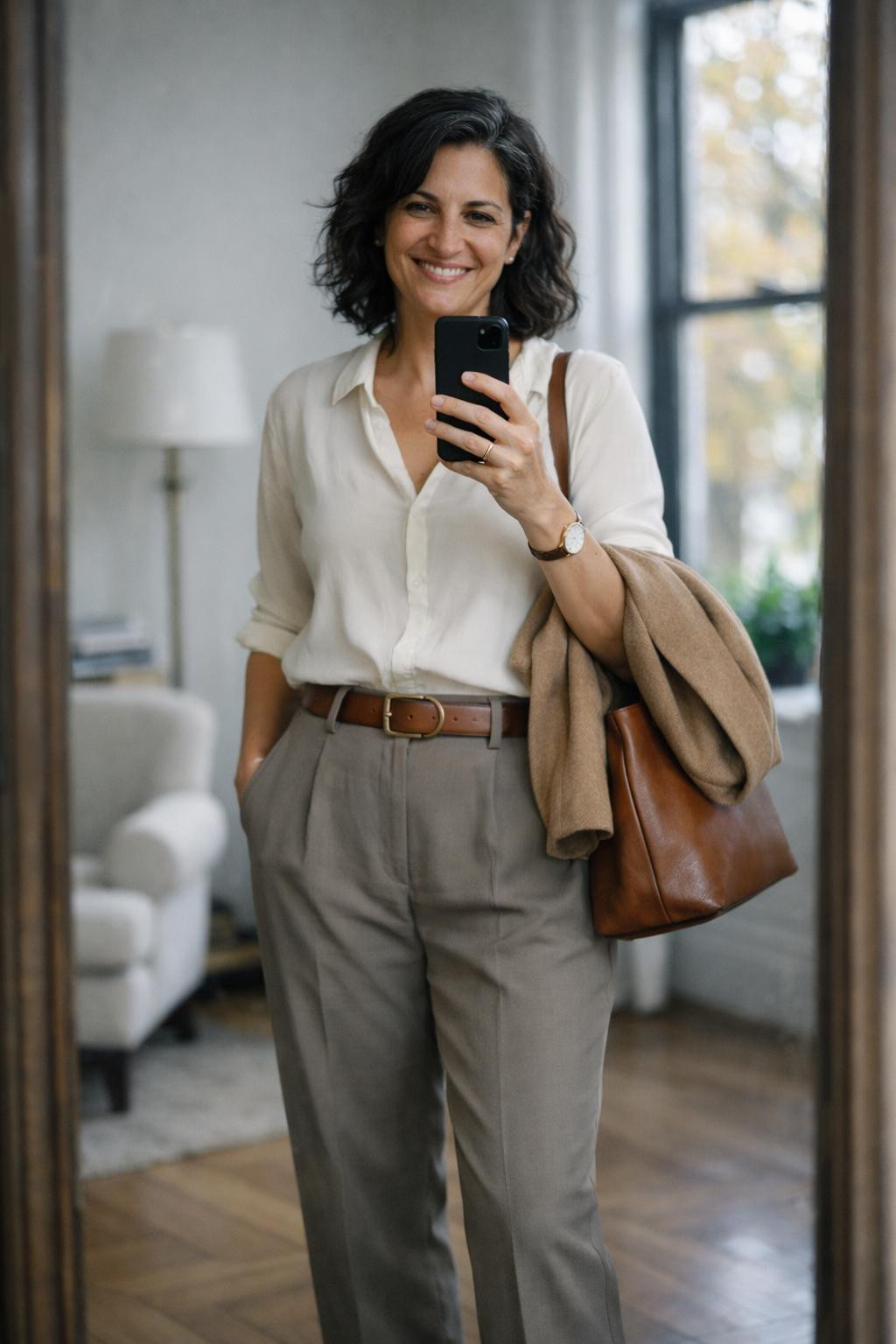 Sustainable business casual with cream silk blouse and taupe trousers
