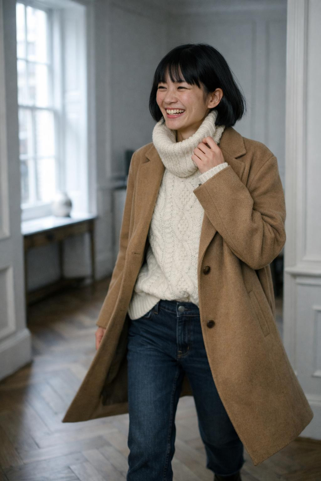 Cute winter outfits with chunky cream cable-knit sweater and camel coat
