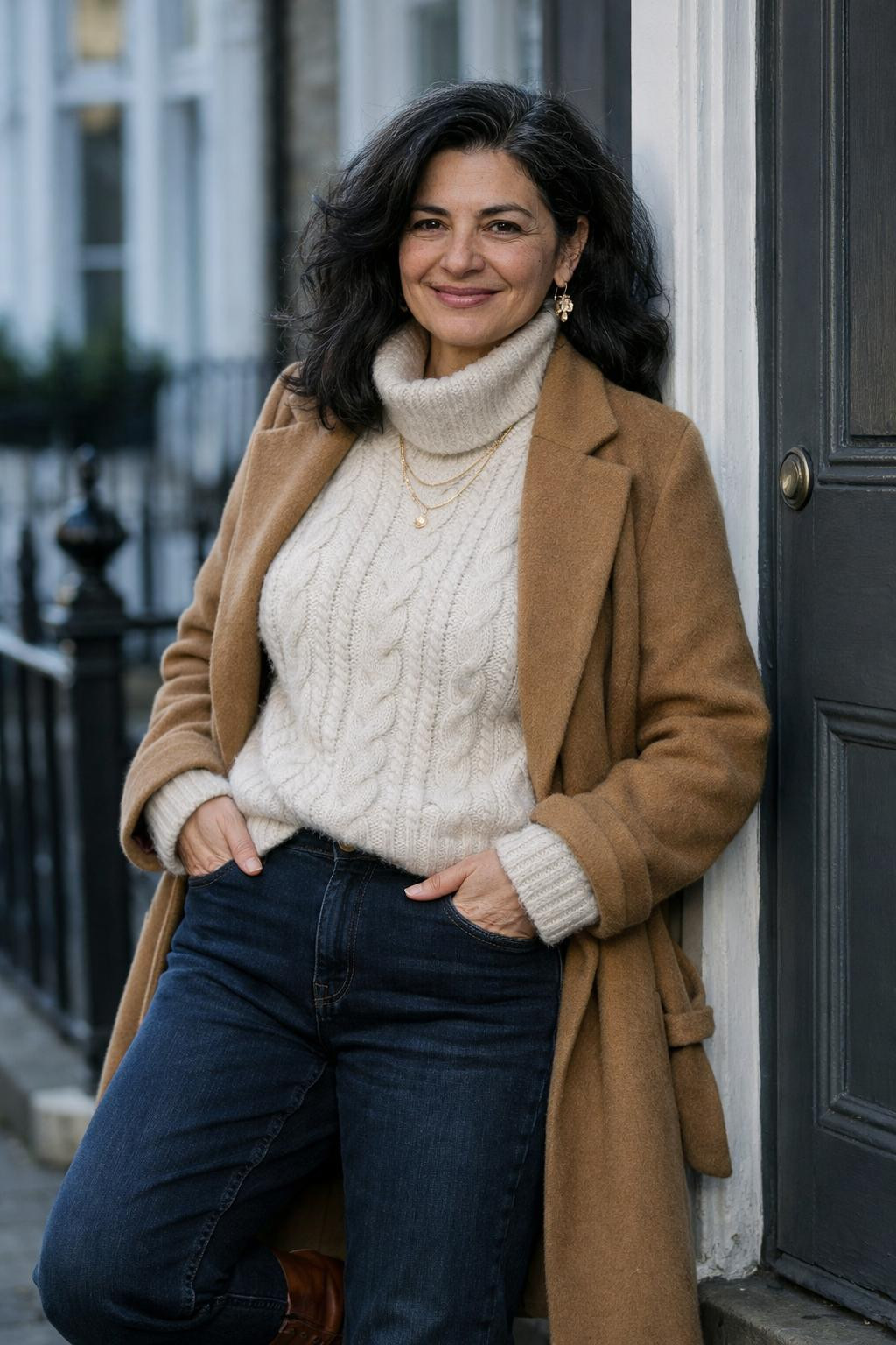 Winter birthday outfit with cream cable-knit sweater and indigo jeans