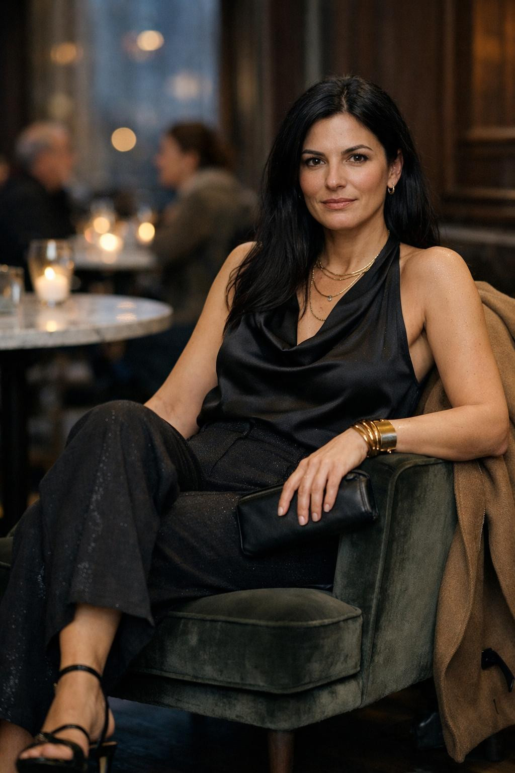 Winter birthday outfit with black satin halter top and shimmer trousers
