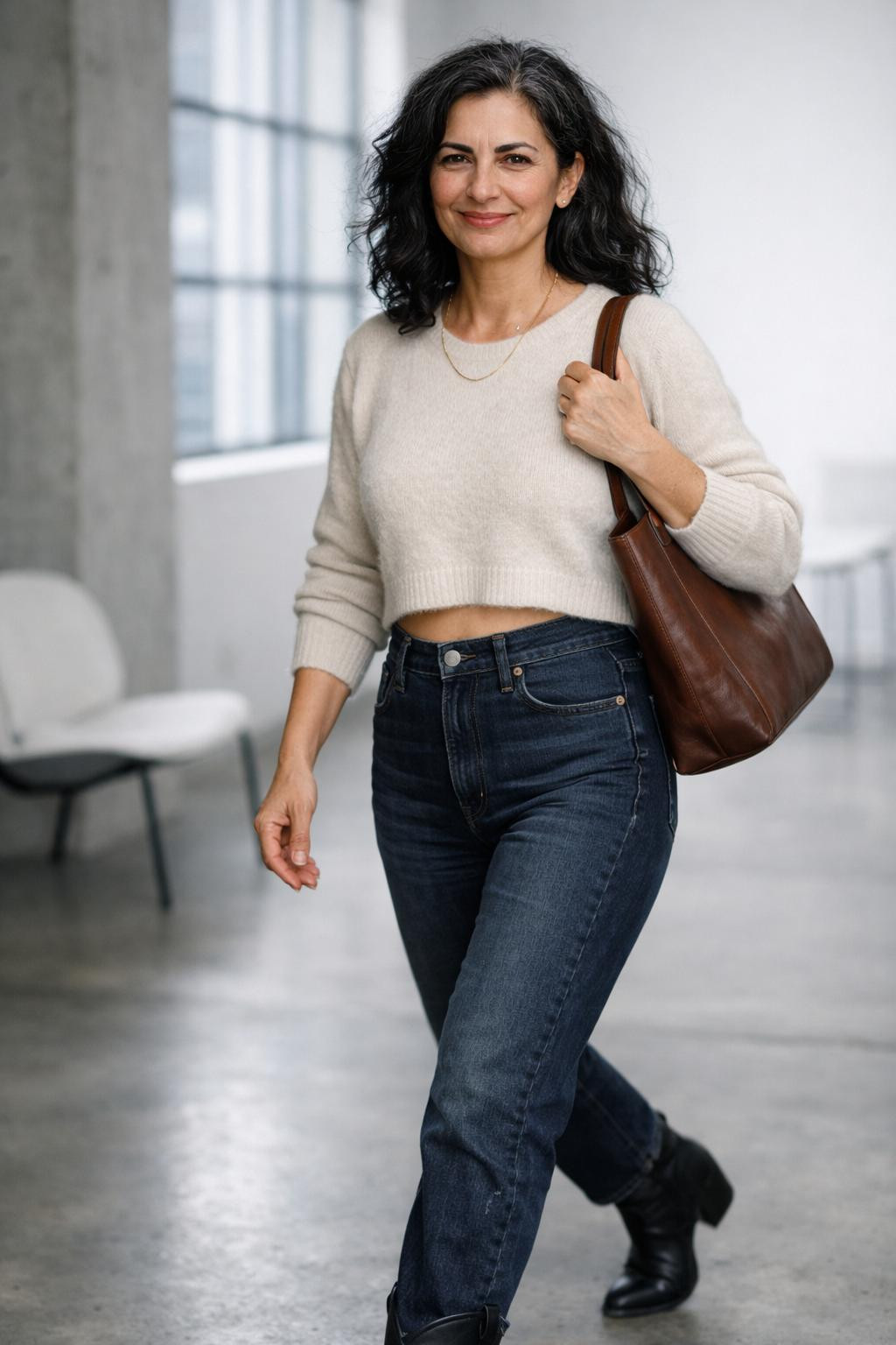 Cowboy boots outfit with cropped cashmere sweater and black ankle boots