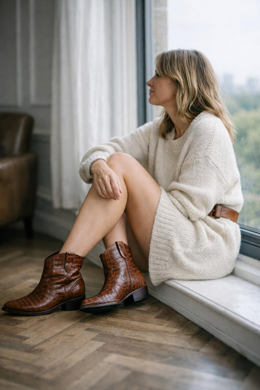 Short cowboy boots outfit featuring cognac croc-embossed boots and cream dress
