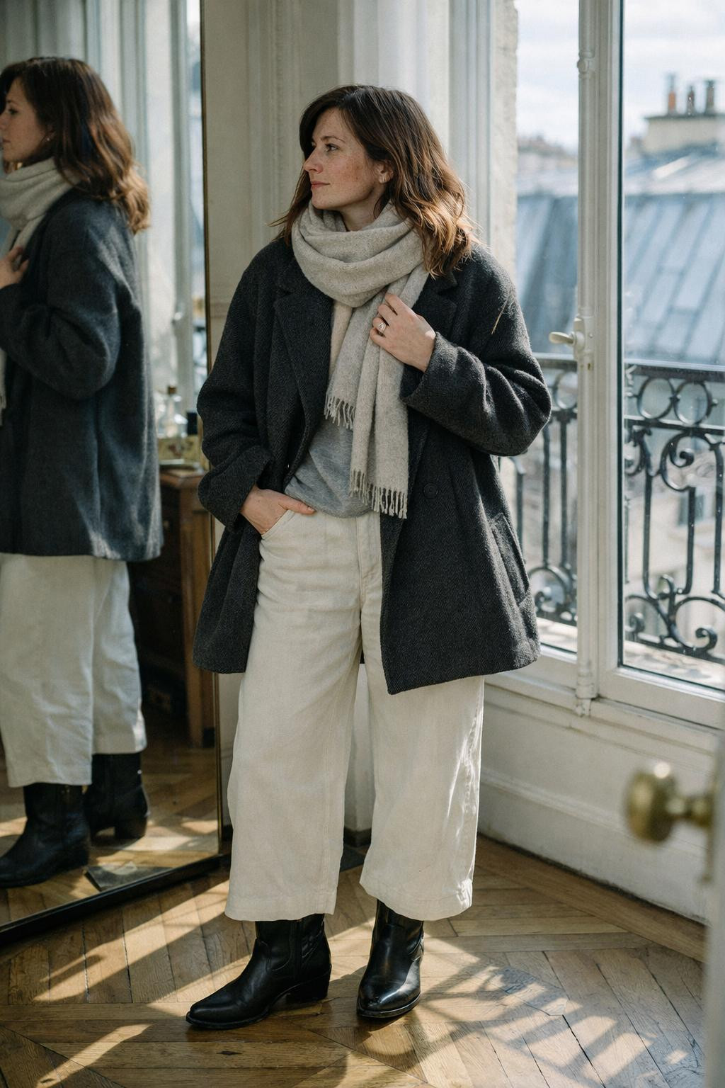 Short cowboy boots outfit with charcoal coat and Parisian style