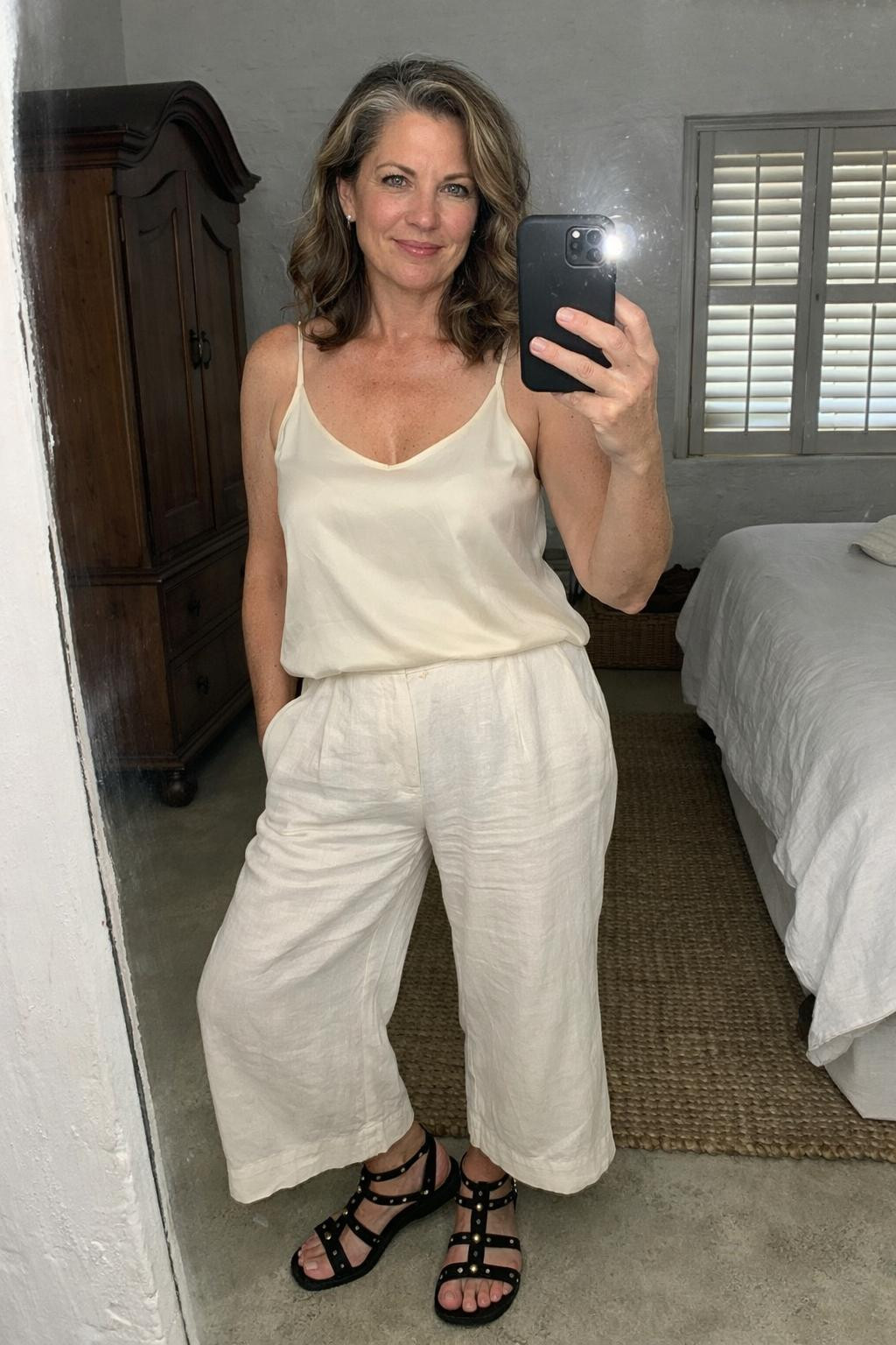 Gladiator sandals outfit with white linen wide-leg pants