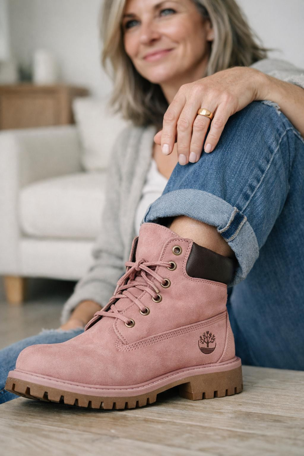 Pink Timberland boots outfit close-up with straight-leg jeans