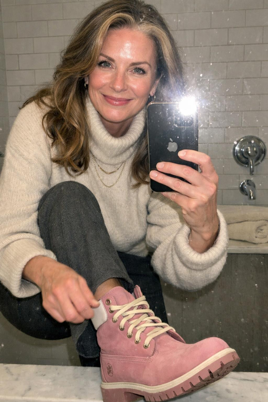 Pink Timberland boots outfit bathroom mirror selfie with grey trousers