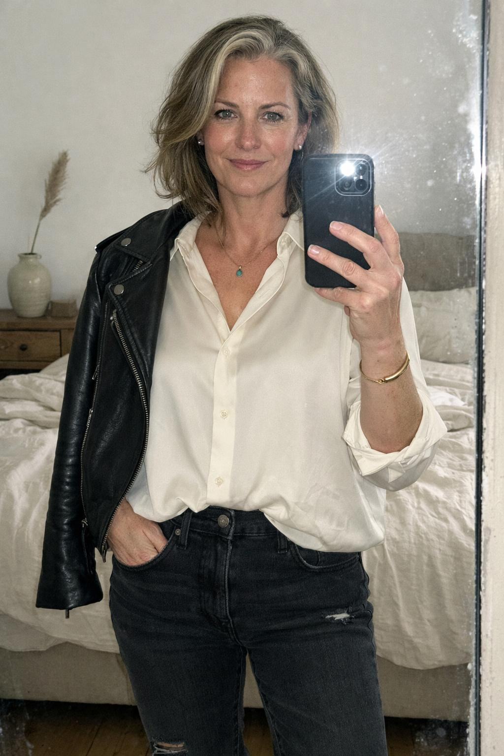 Outfits with Ugg boots featuring black jeans and draped moto jacket