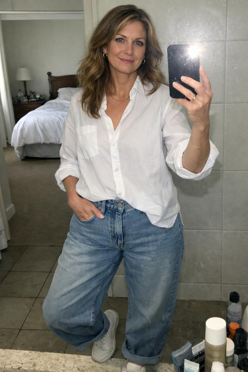 Baggy jeans outfit bathroom mirror selfie with rolled cuffs
