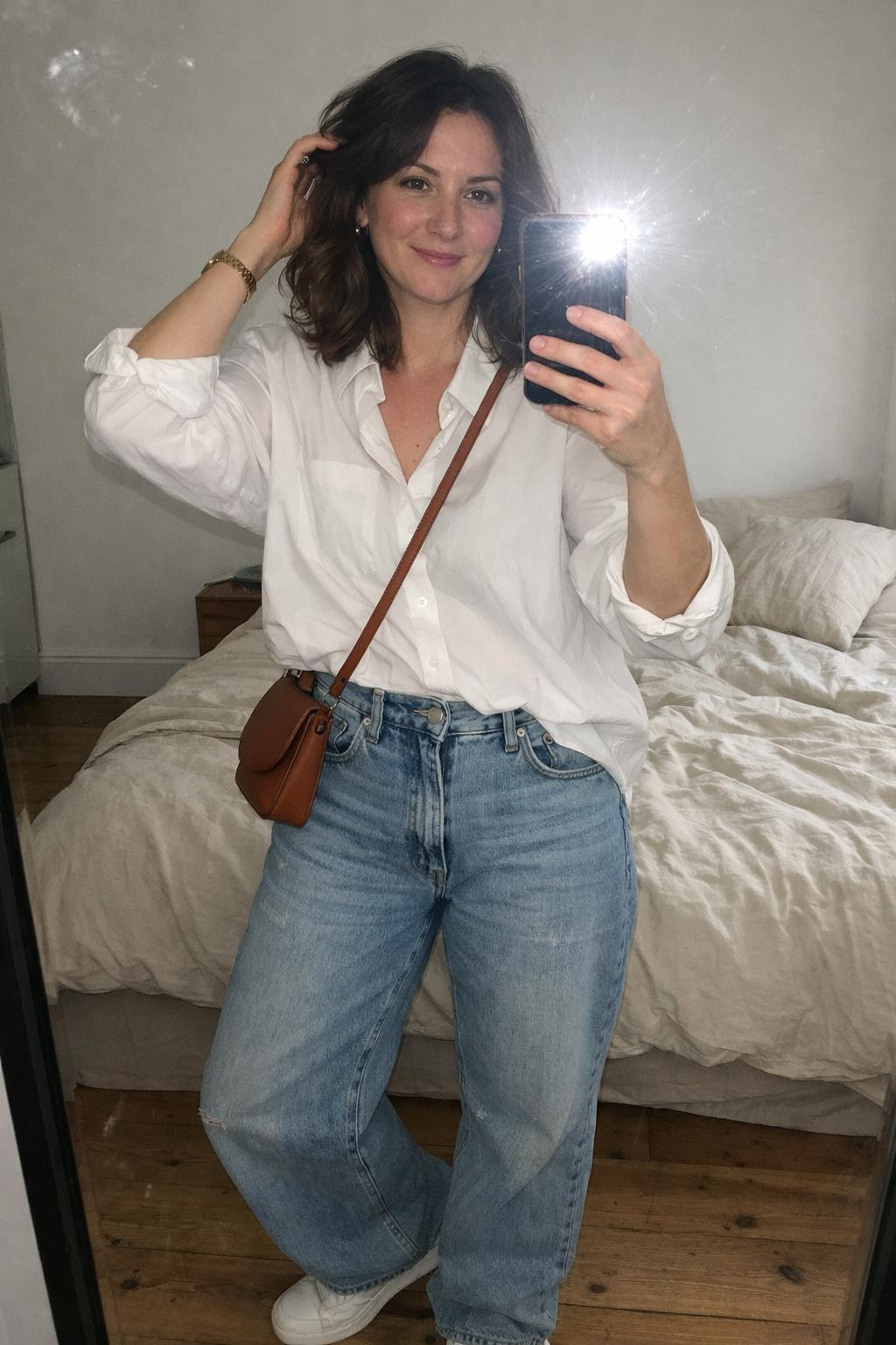Baggy jeans outfit bedroom selfie with half-tucked white shirt