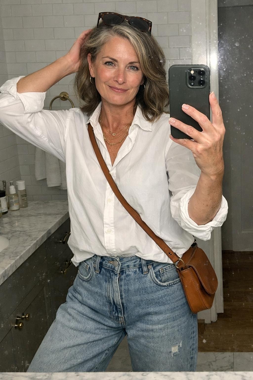 Baggy jeans outfit bathroom selfie with rolled cuffs and white button-down