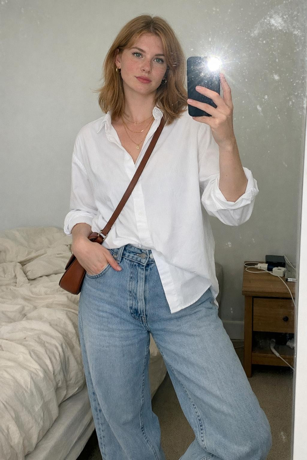 Baggy jeans outfit mirror selfie with oversized white shirt and sneakers