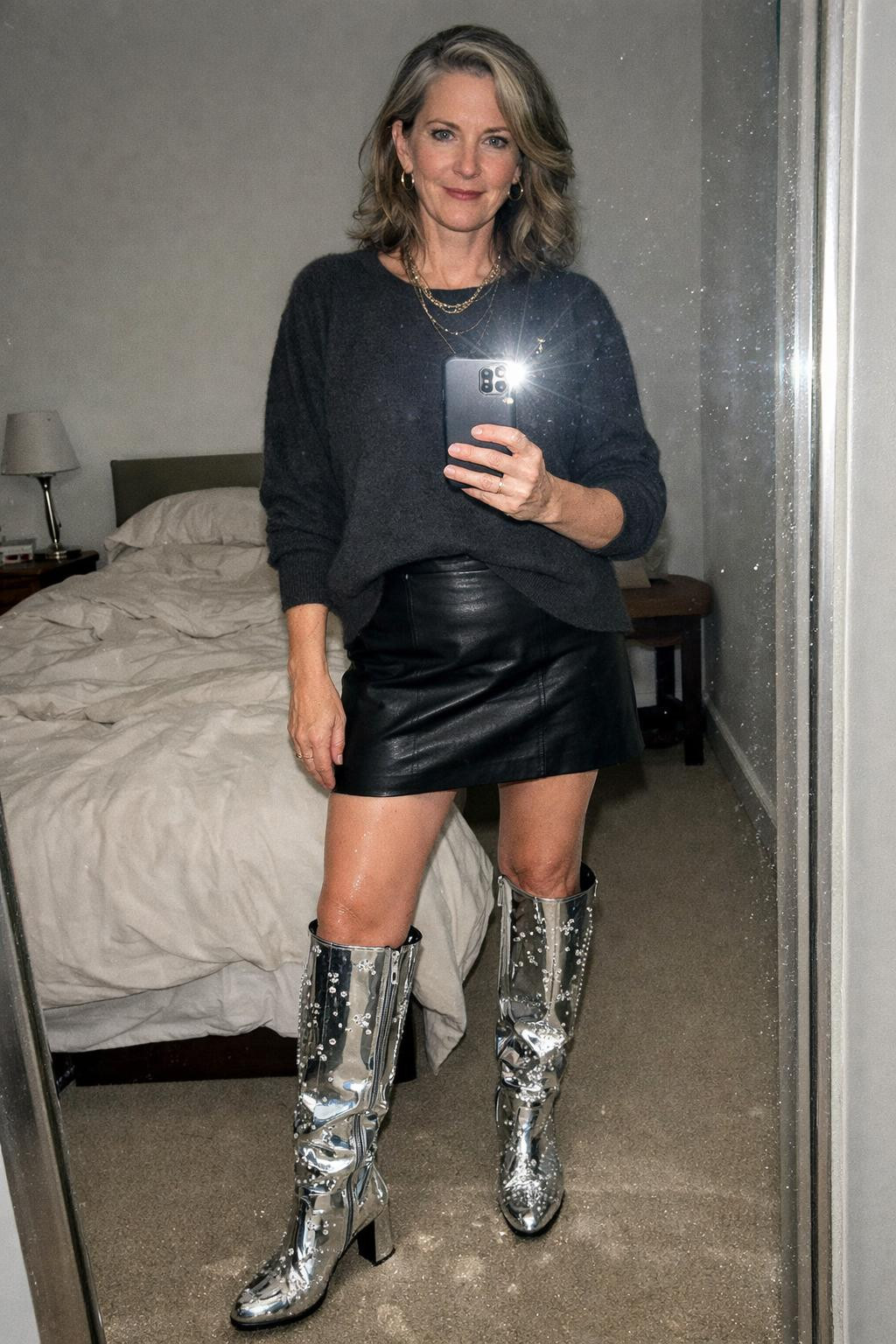 Sparkly boots outfit with chrome metallic knee-high boots and mini skirt