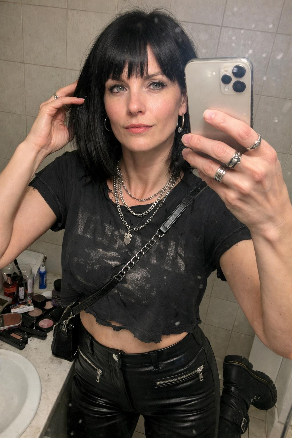 Concert outfit ideas with black band tee and leather pants
