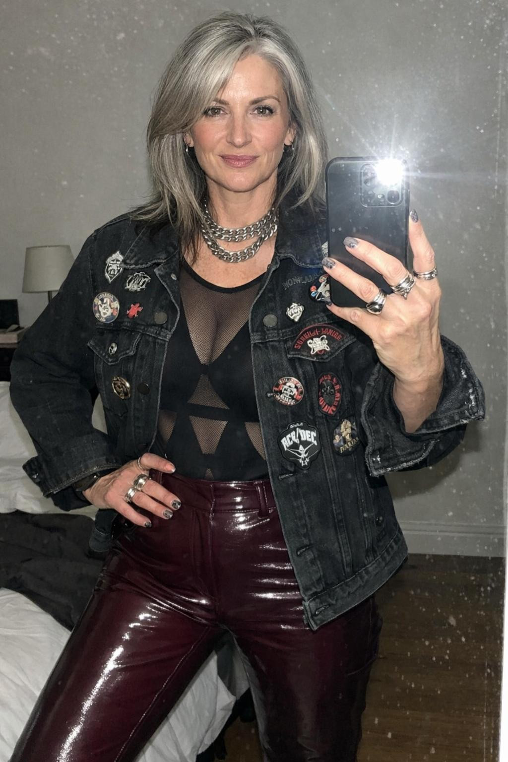 Rock concert outfit with burgundy vinyl pants and silver jewelry