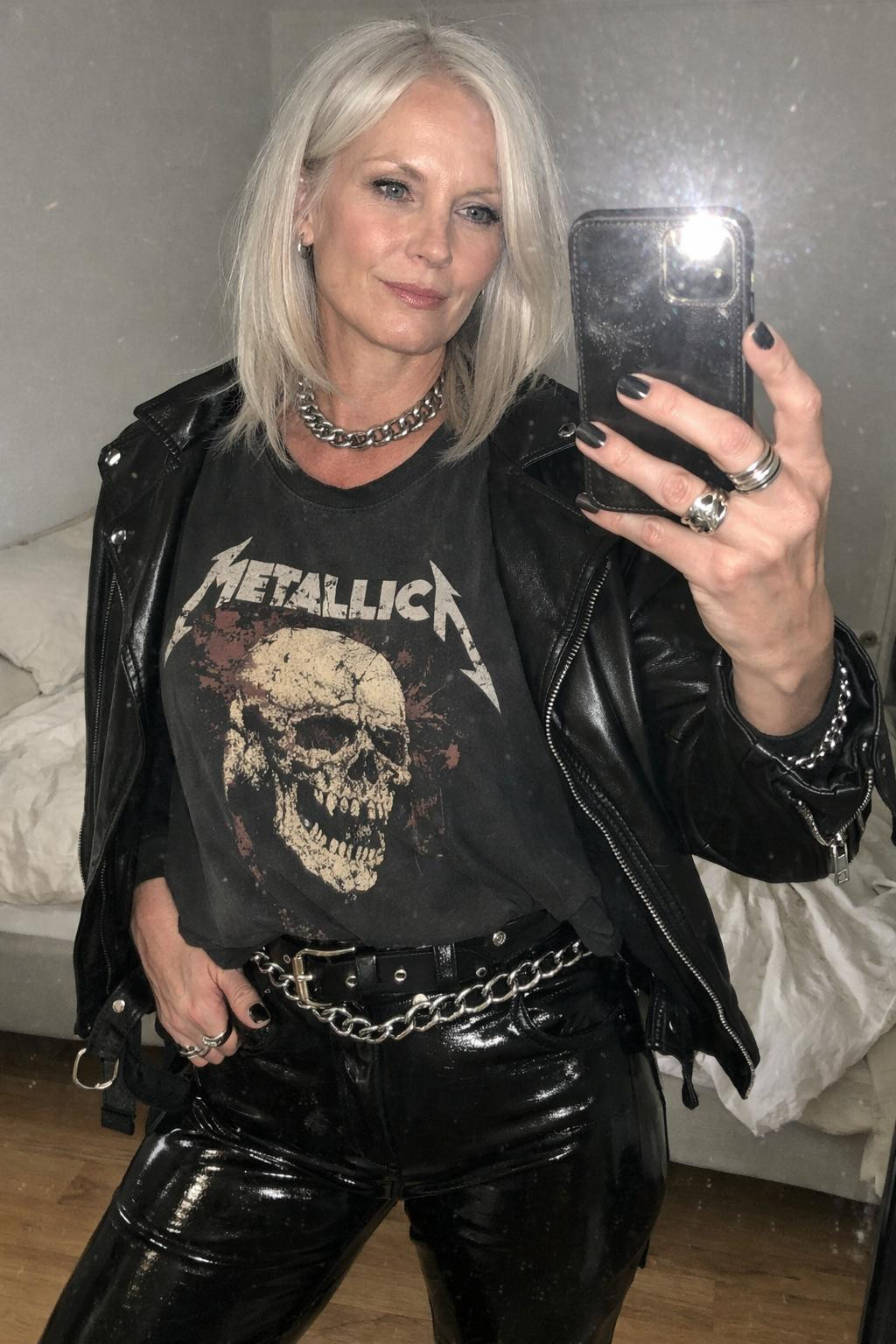 Rock concert outfit with sleek black leather and silver chains