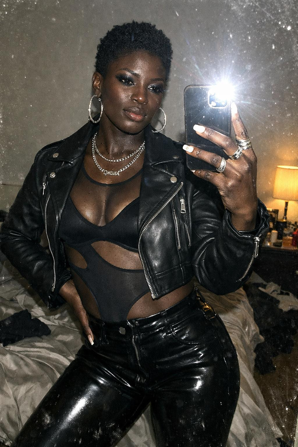 Concert outfit black women featuring mesh bodysuit with strategic cutouts