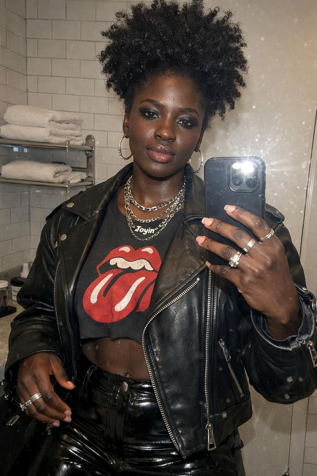 Concert outfit black women with vinyl pants and smokey eye makeup