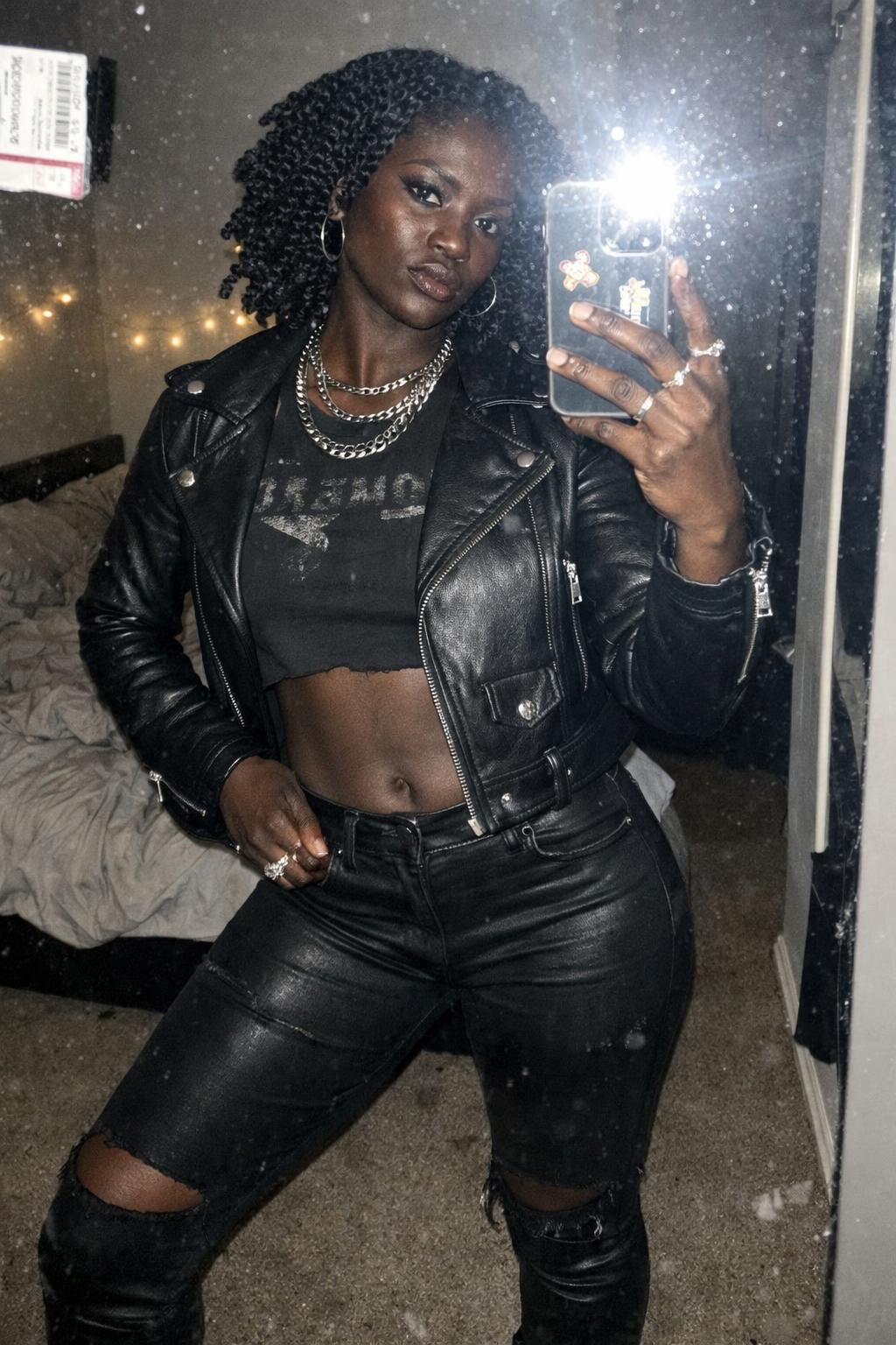 Concert outfit black women with nameplate chain necklace and twist-out hairstyle