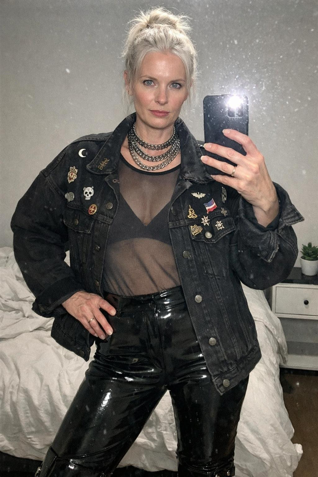 Summer concert outfit with moody oversized black denim jacket and mesh bodysuit for mature style