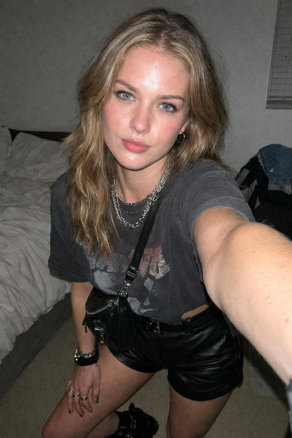Summer concert outfit with cropped vintage band tee and high-waisted leather shorts