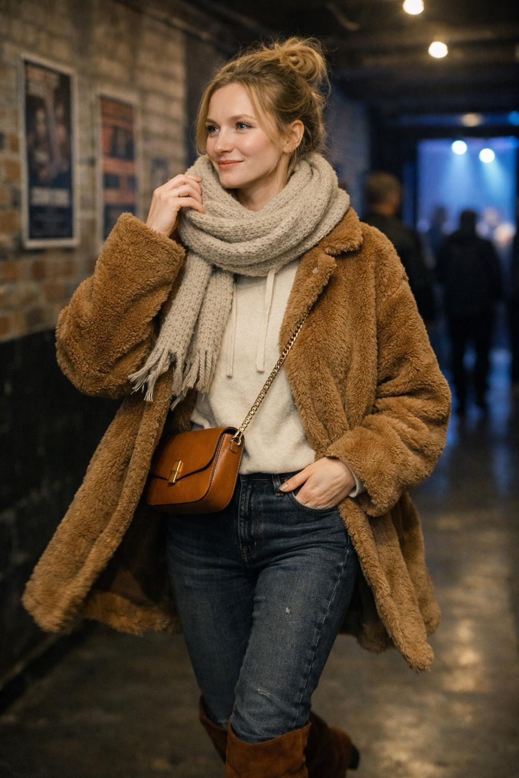 Winter concert outfit ideas in venue hallway with atmospheric lighting