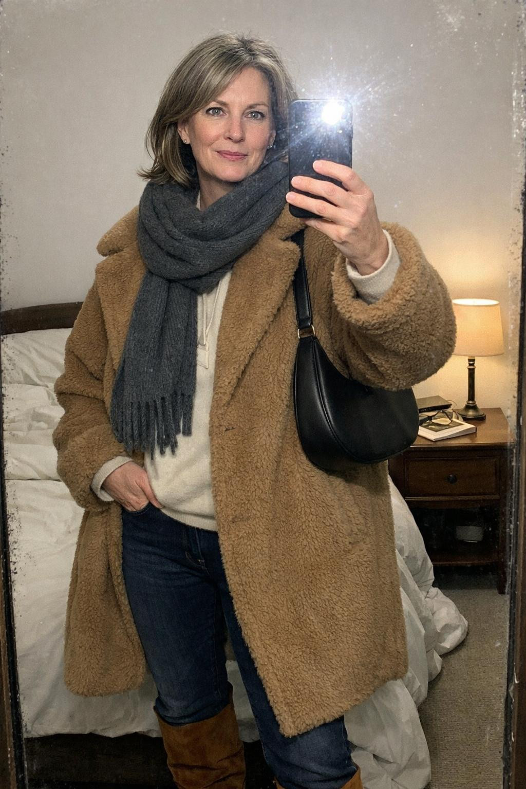 Winter concert outfit in cozy bedroom with warm lighting