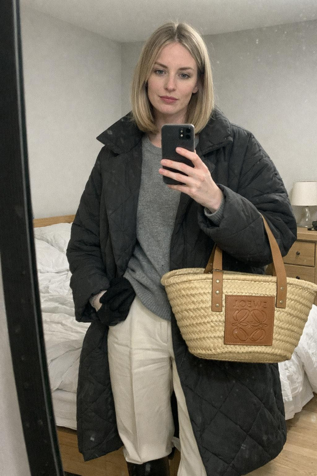 Cozy airport outfit mirror selfie with cream trousers