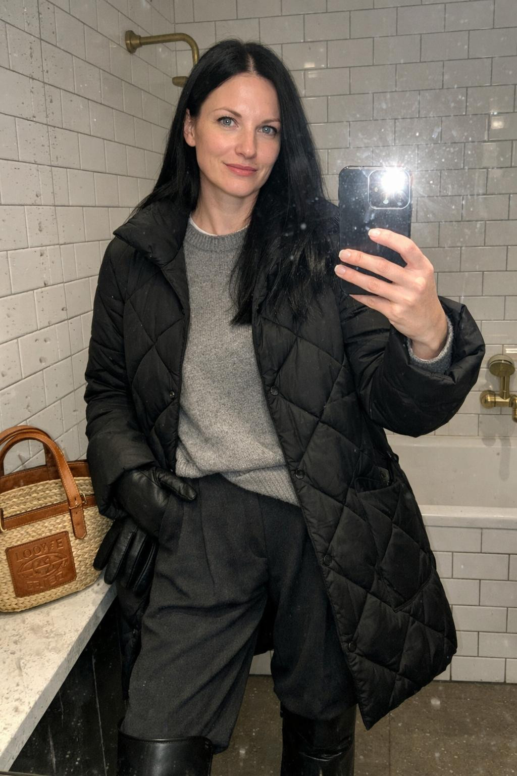 Cozy airport outfit bathroom selfie with subway tiles