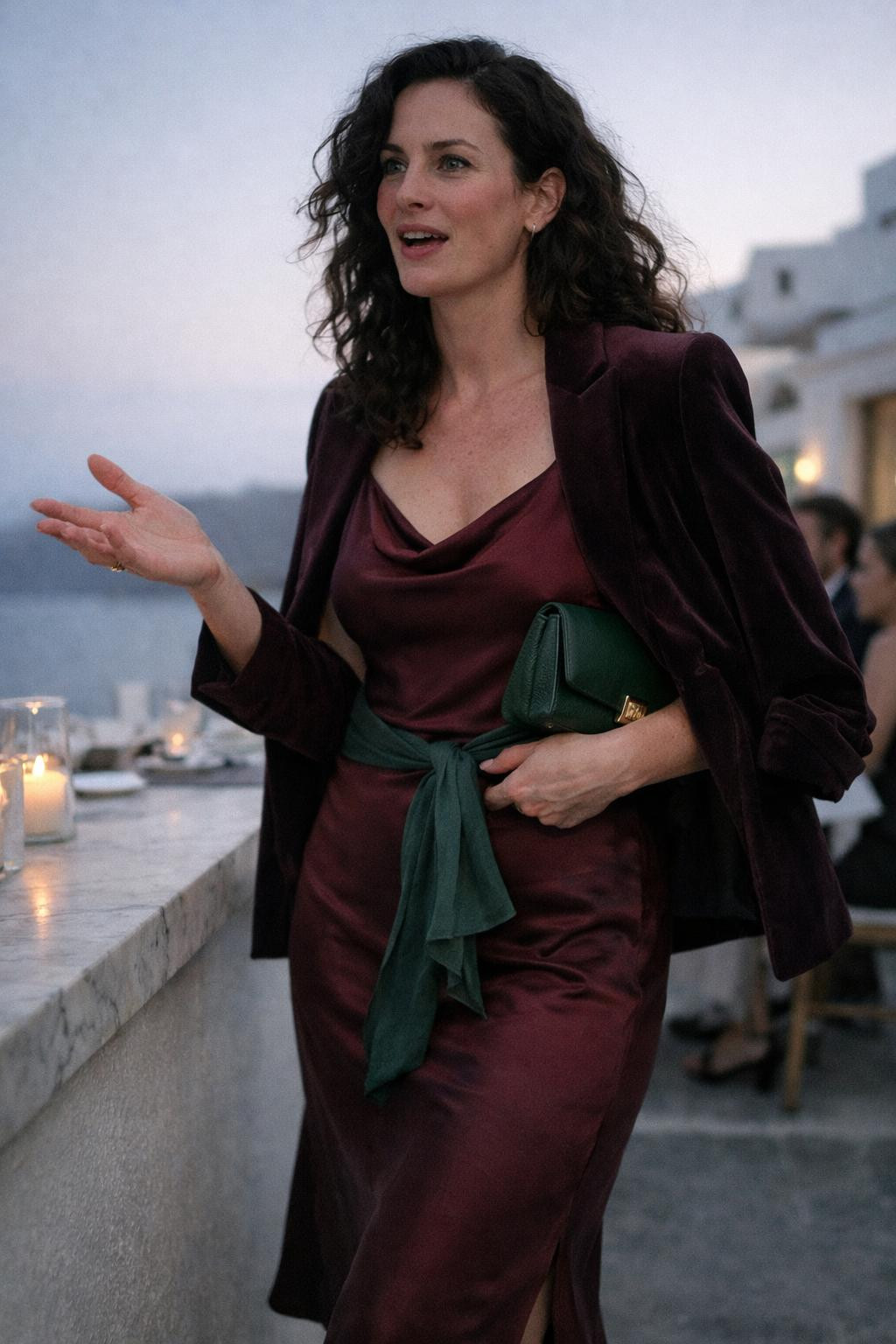 Holiday party outfit with body-conscious burgundy silk and velvet blazer