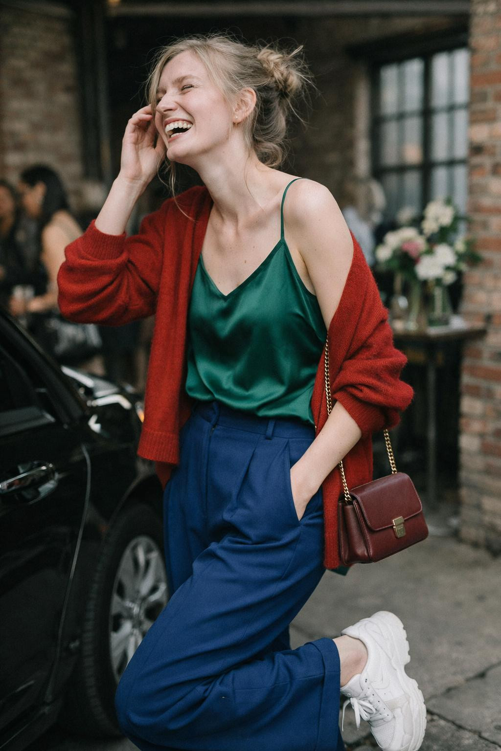 House party outfit with emerald silk camisole and sapphire wool tailored trousers
