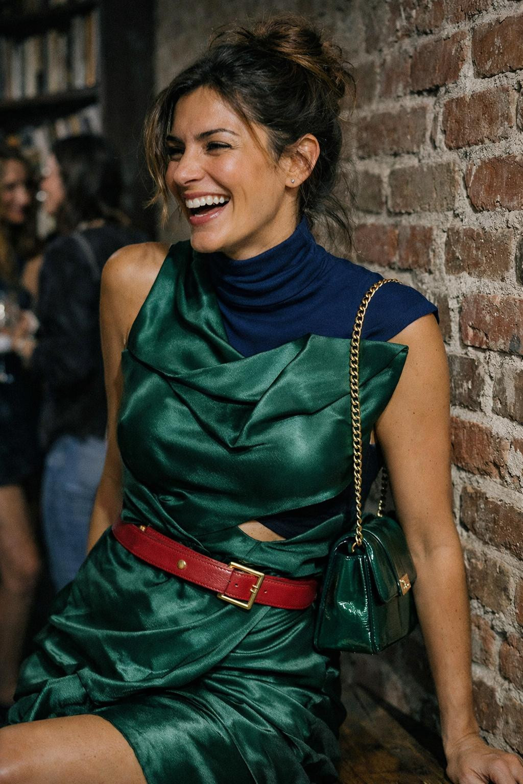 House party outfit with architectural emerald silk dress and sapphire turtleneck