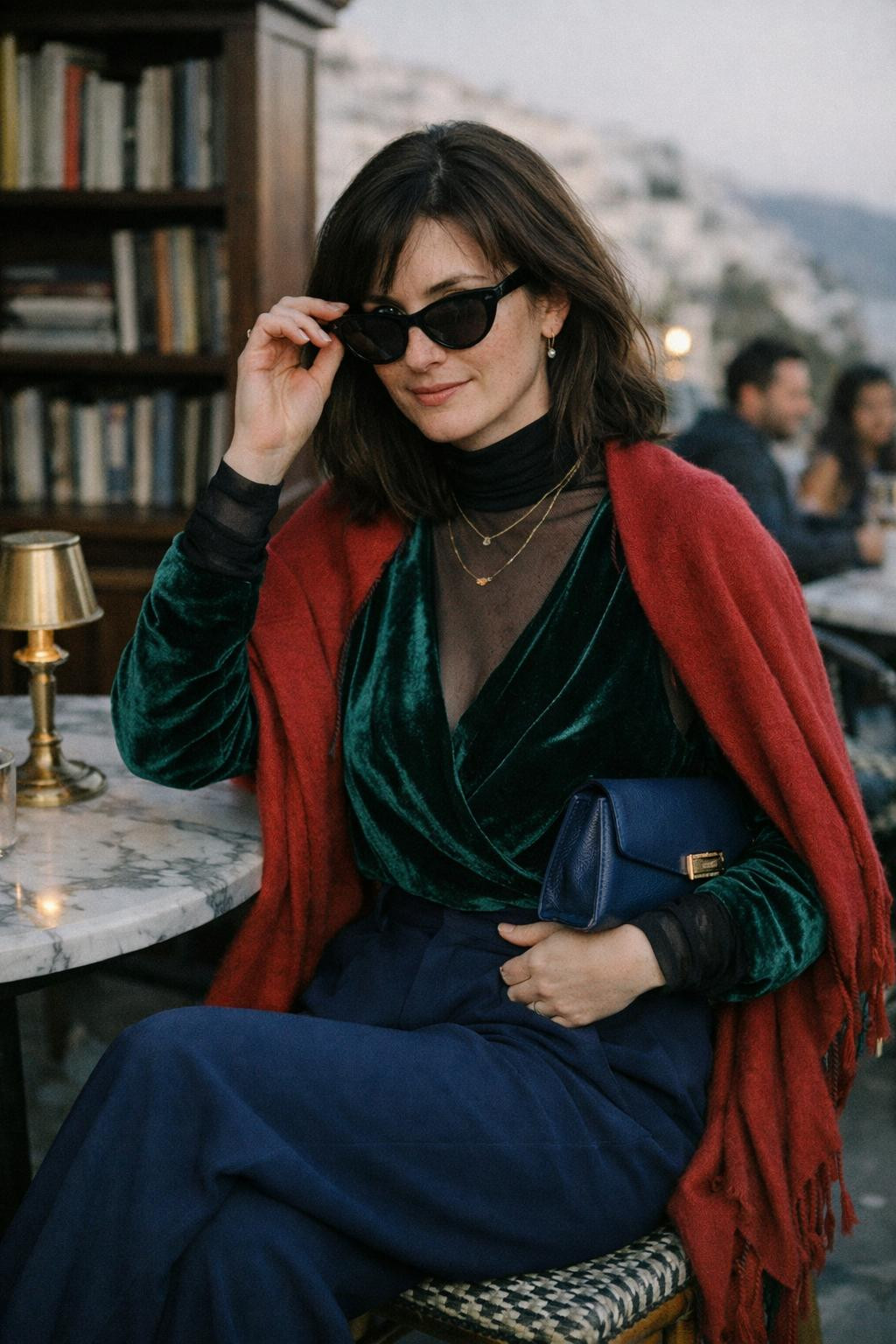 Winter party outfit with layered emerald velvet wrap and mesh turtleneck