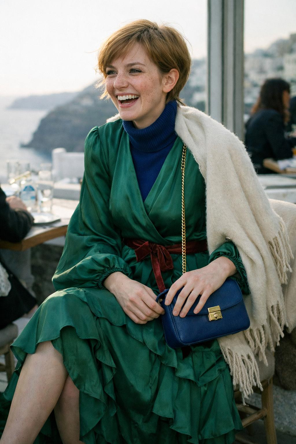 Winter party outfit with flowing emerald silk wrap dress