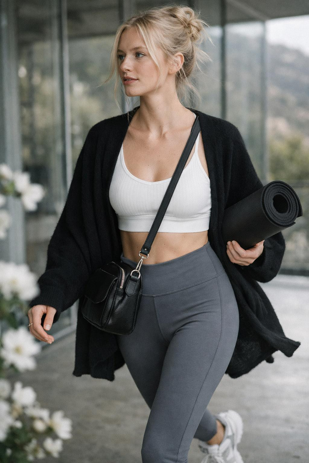 Gym outfit with white sports bra and black wrap cardigan