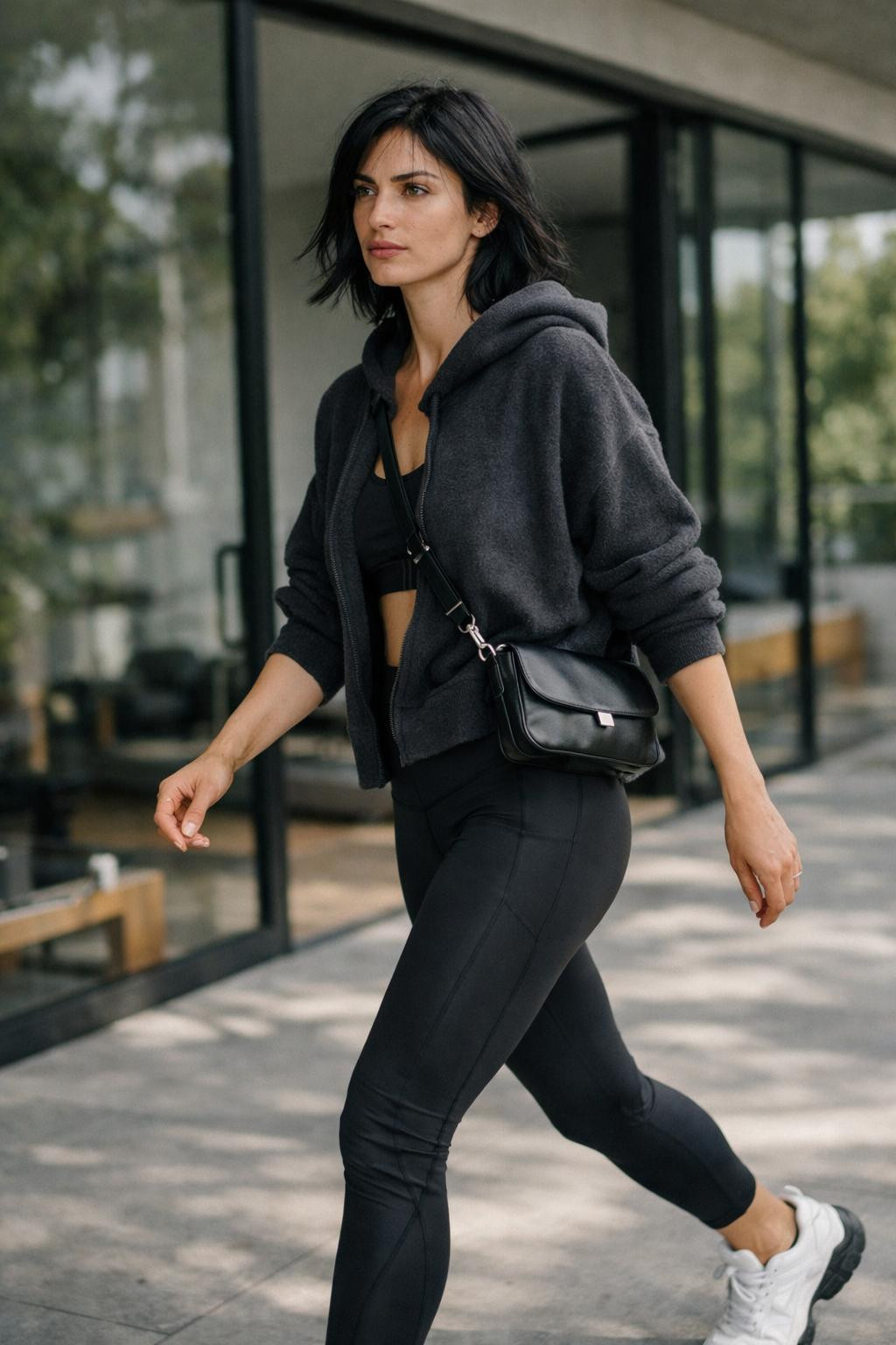 Gym outfit with oversized charcoal hoodie and black leggings