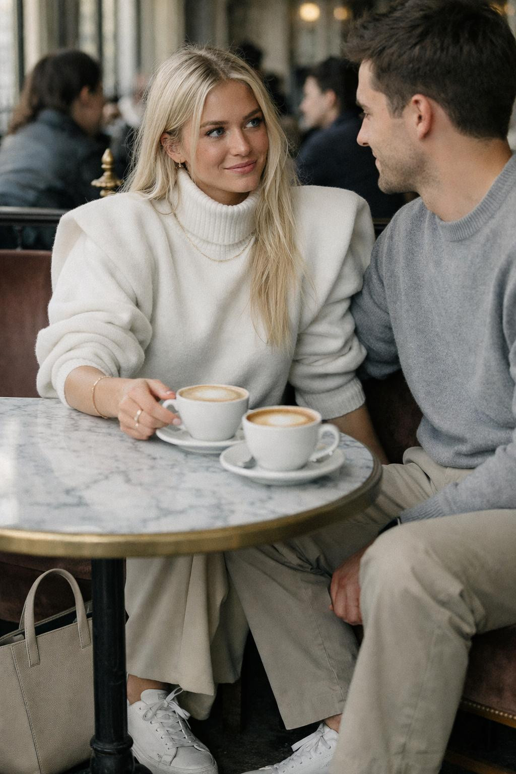 Couples Valentine's outfit with oversized white turtleneck and beige tailored trousers