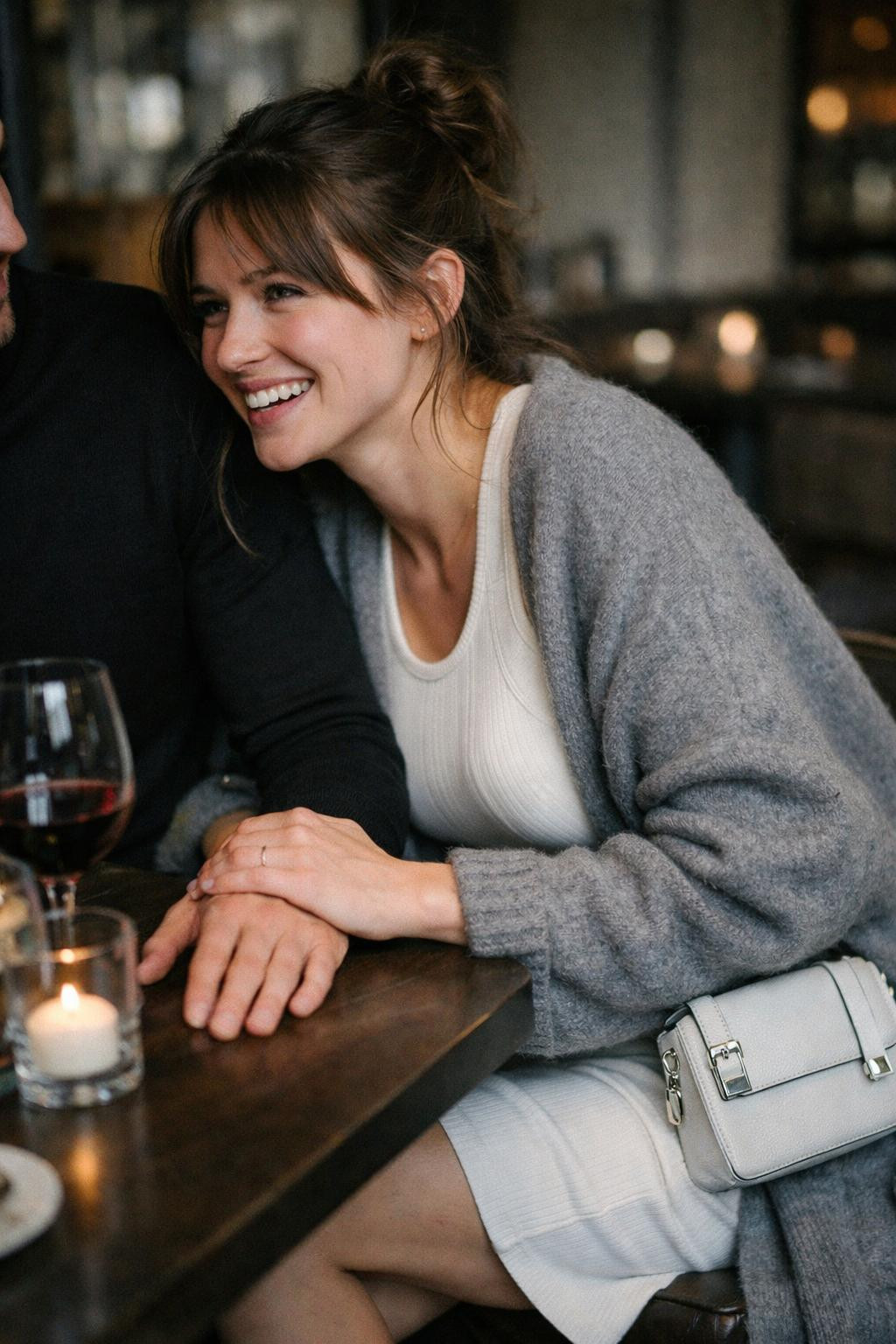 Couples Valentine's outfit with white ribbed knit dress and grey cardigan
