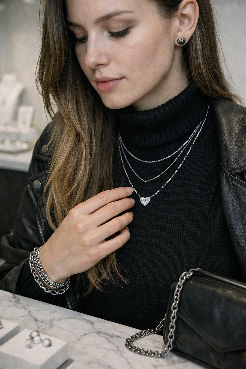 Valentine's Day jewelry with delicate silver heart pendant and layered necklaces