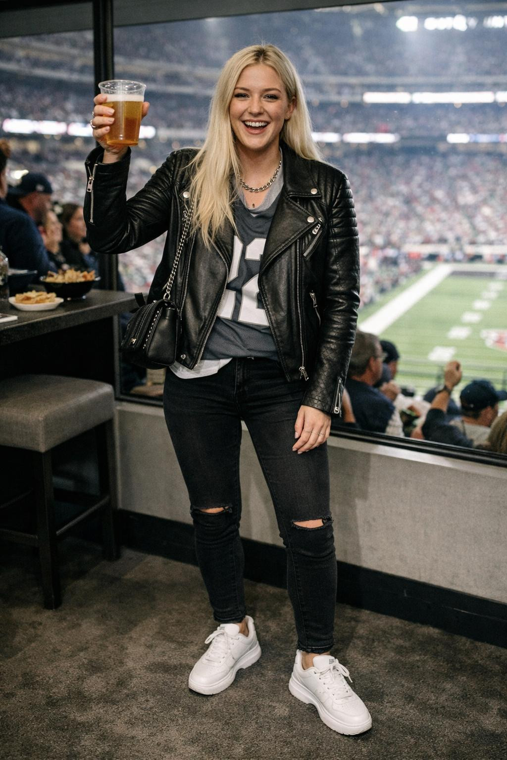 Super Bowl outfit with black leather jacket and grey team jersey