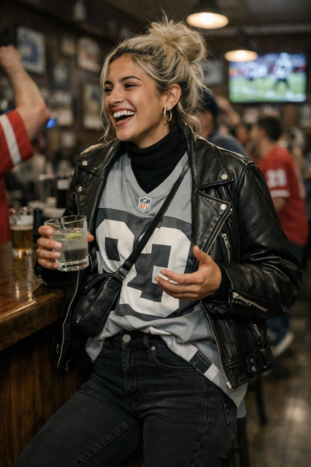 Super Bowl outfit with grey jersey and black leather moto jacket