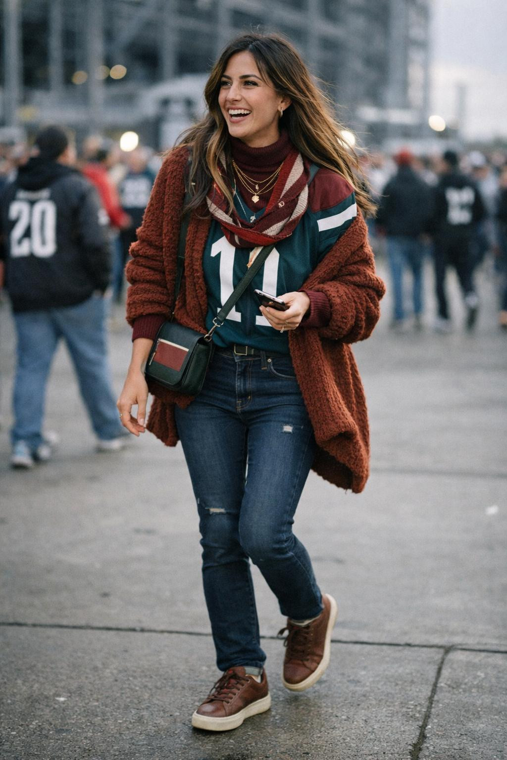 Super Bowl outfit ideas with layered burgundy turtleneck and chunky cardigan