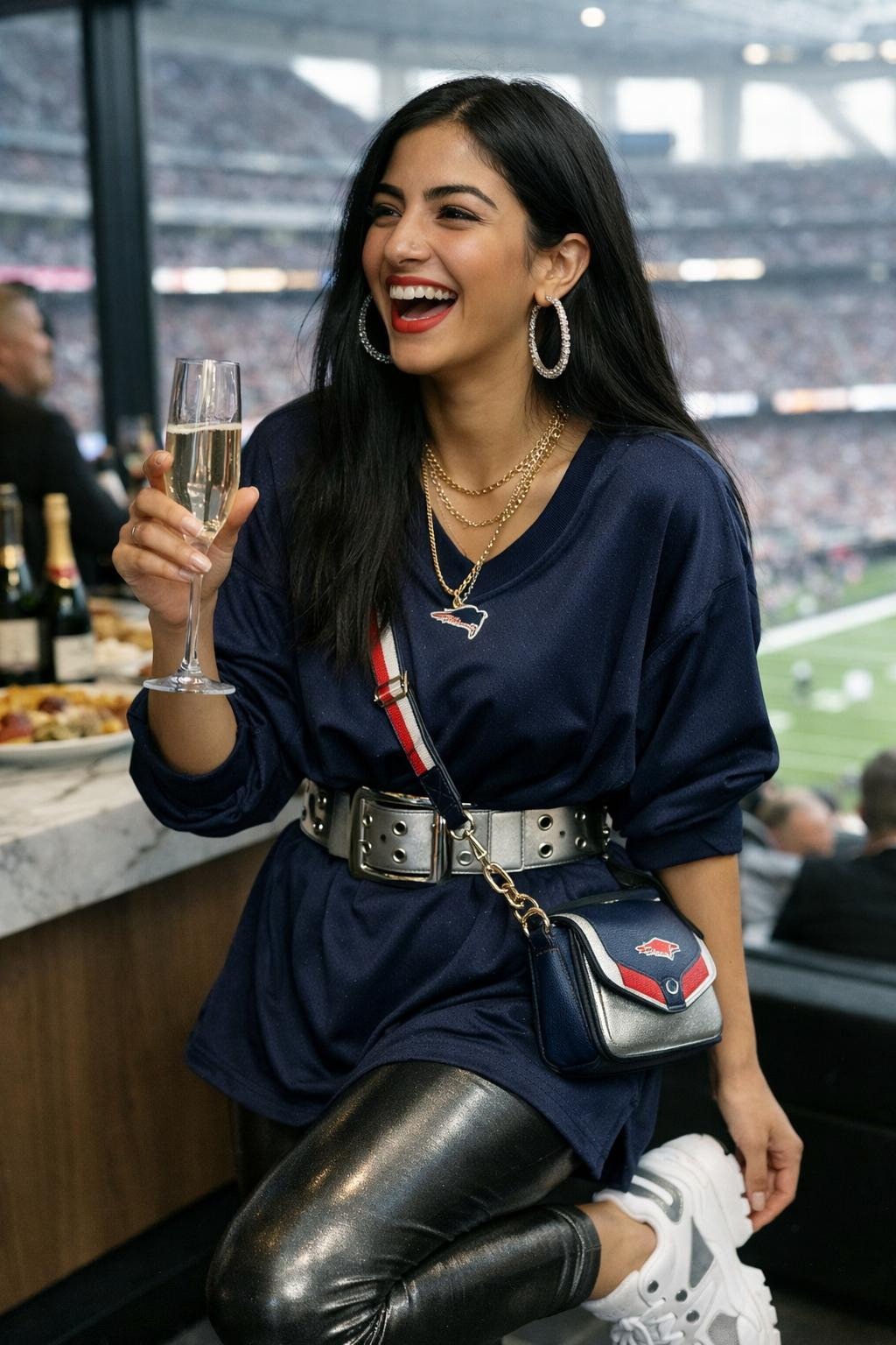 Super Bowl outfit with navy oversized jersey and metallic silver leggings