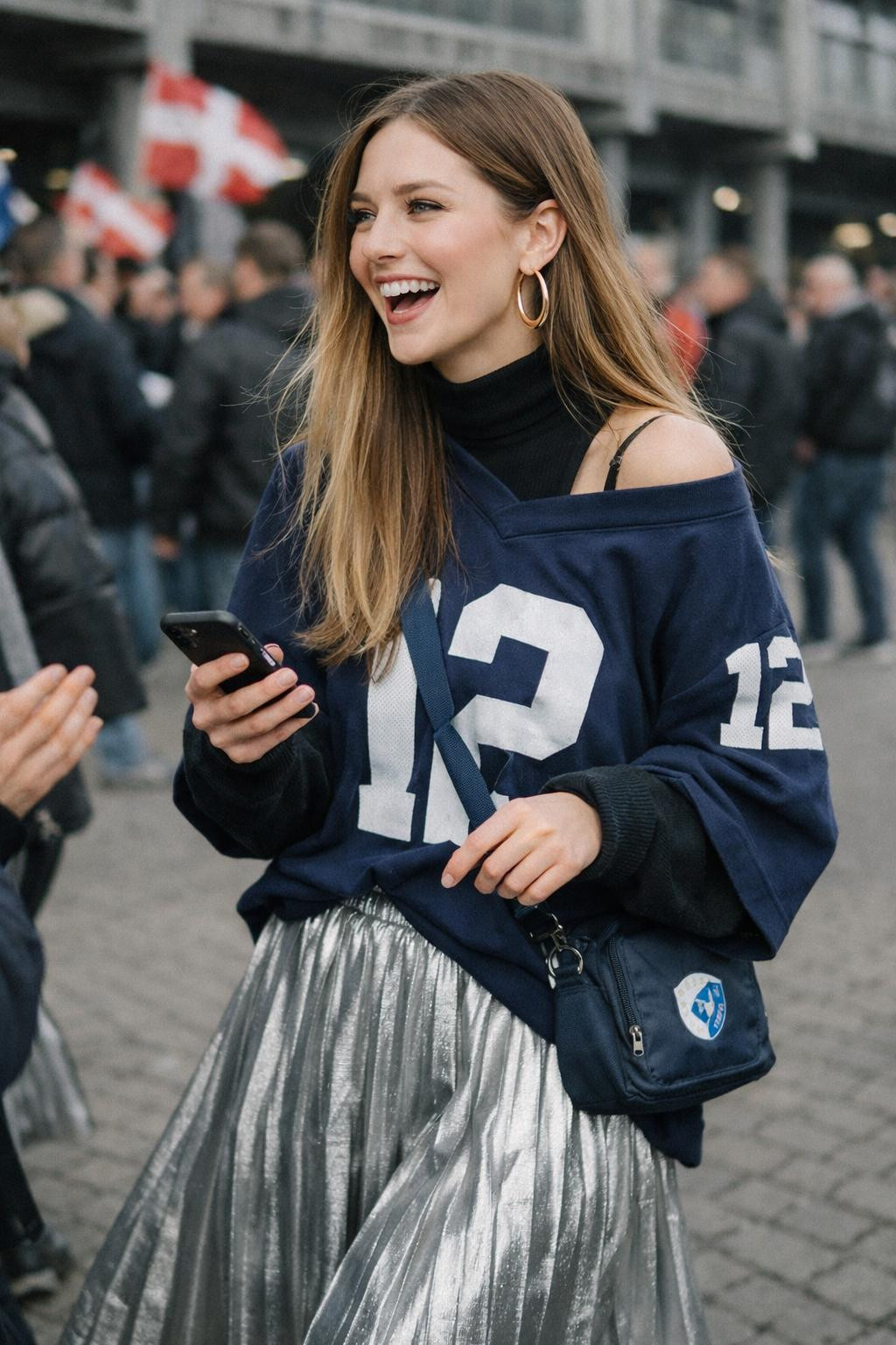 Game day outfit with navy jersey and metallic silver pleated midi skirt