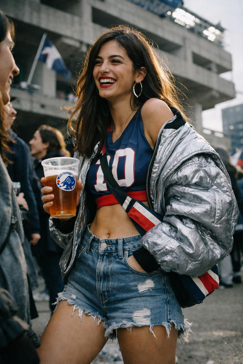 Football game outfit with cropped jersey and metallic bomber jacket