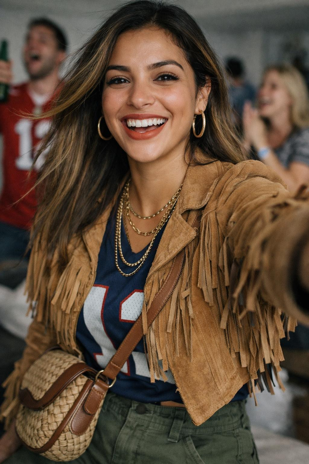 Super Bowl party look with tan suede fringe jacket and navy jersey