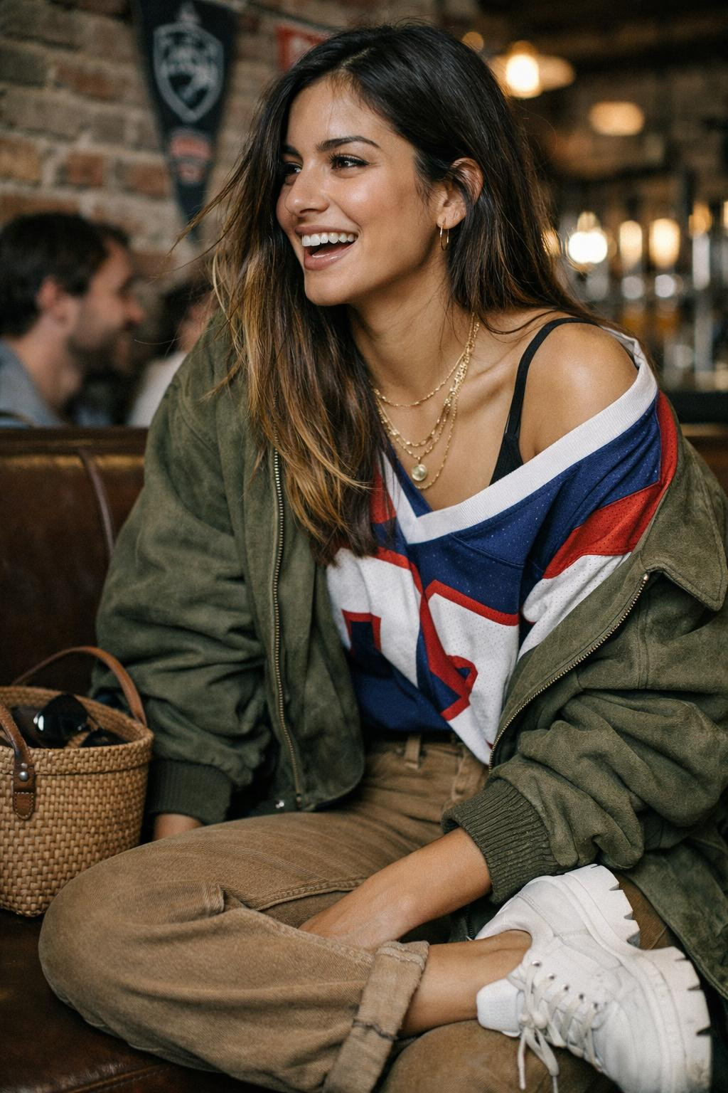Super Bowl party look with vintage jersey and olive suede bomber
