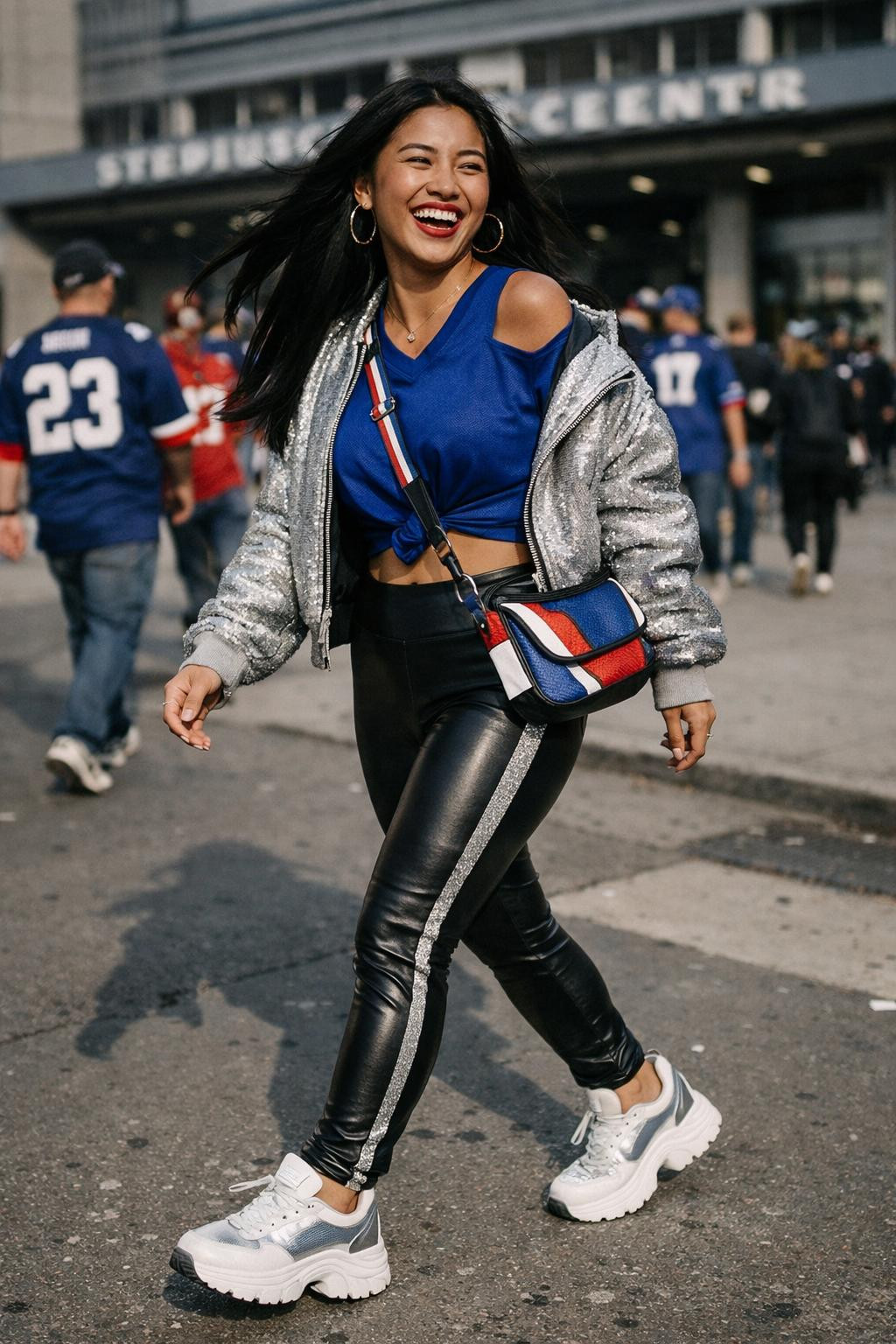 Super Bowl party look with cobalt blue jersey and silver bomber jacket