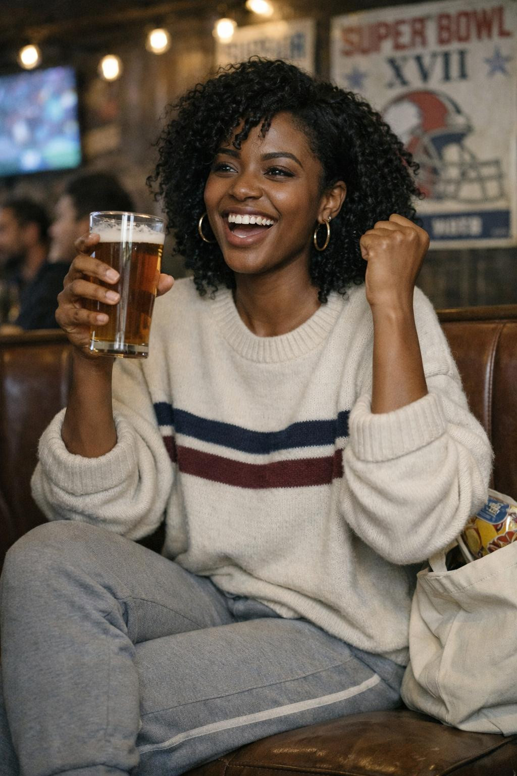 Super Bowl party look with cream cashmere sweater and grey joggers