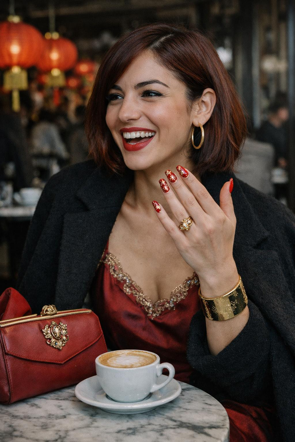 Chinese New Year nails with festive red and gold cloud patterns