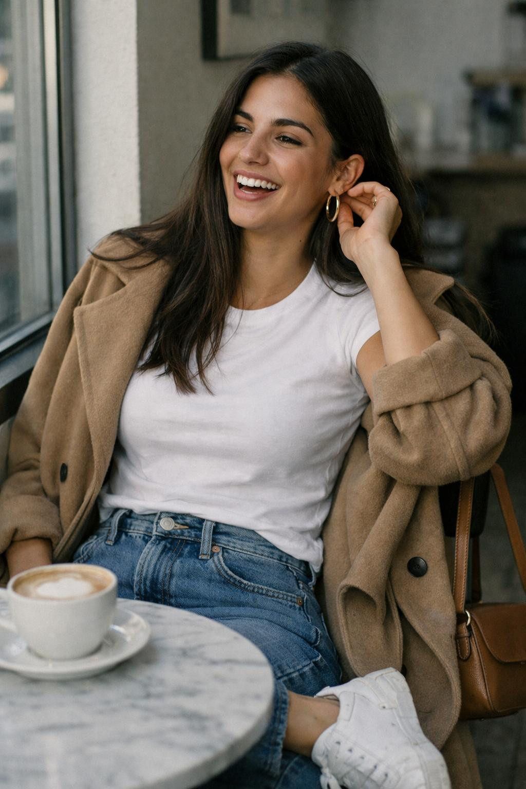 First date outfit with camel trench coat over white tee and denim